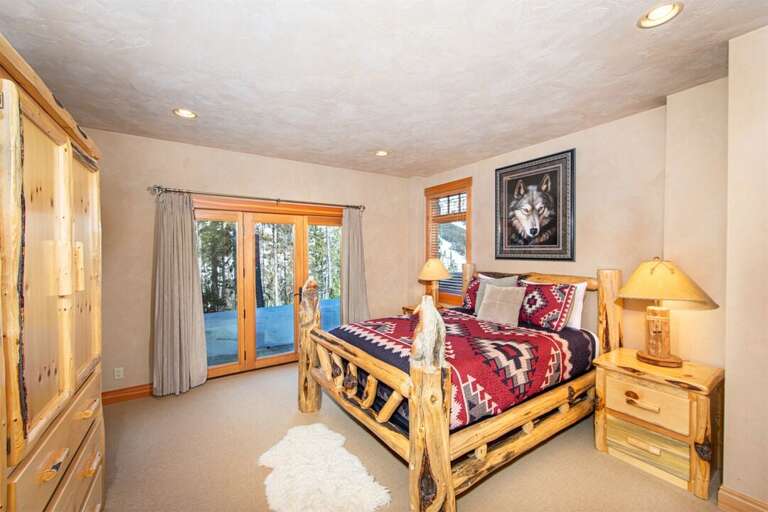 The `Wolf` room features a queen bed, private patio & ensuite bathroom | Lower Level The `Wolf` room features a queen bed, private patio & ensuite bathroom | Lower Level